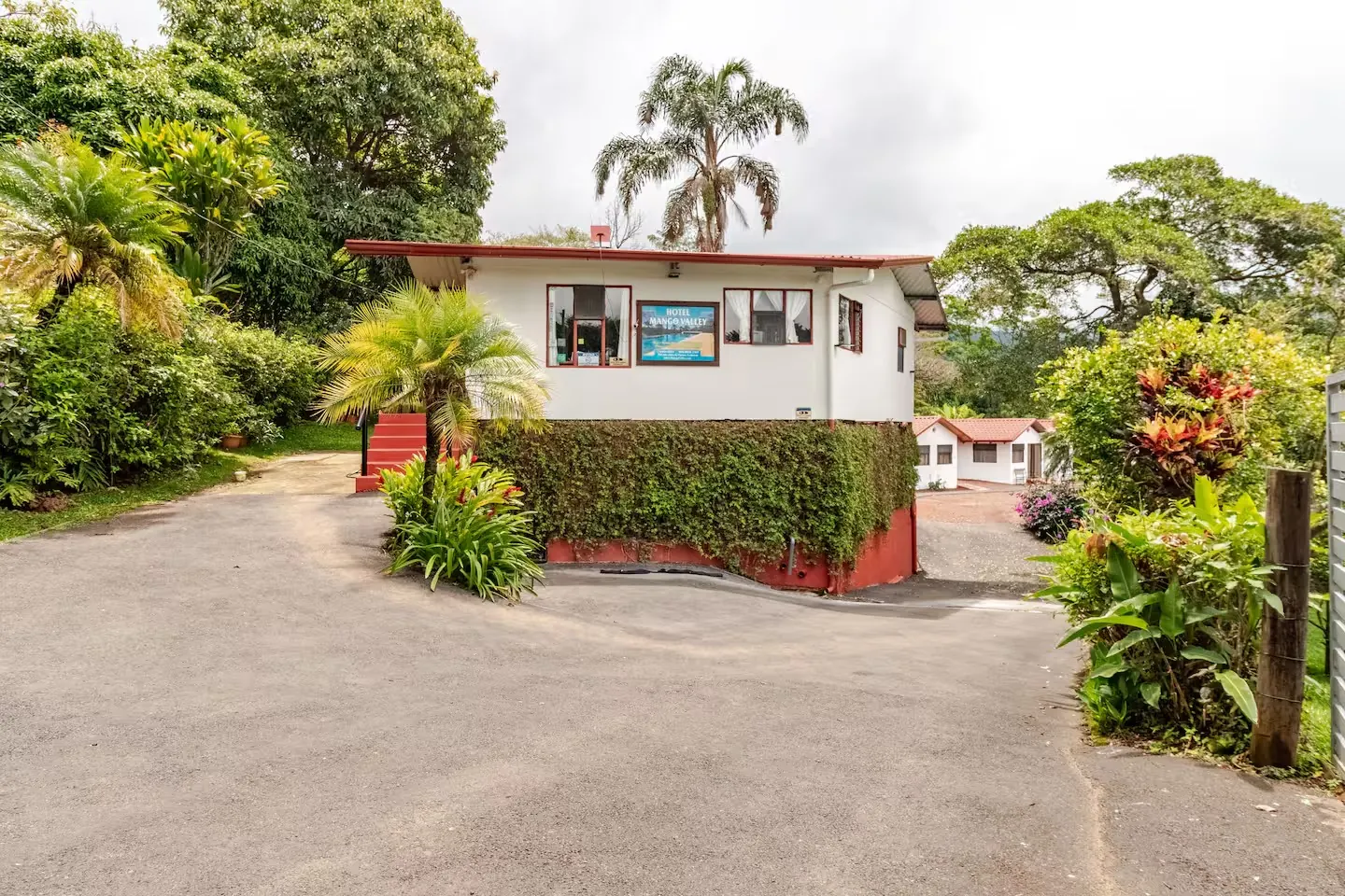 Hotel Mango Valley reception surrounded by tropical gardens in Grecia, Costa Rica