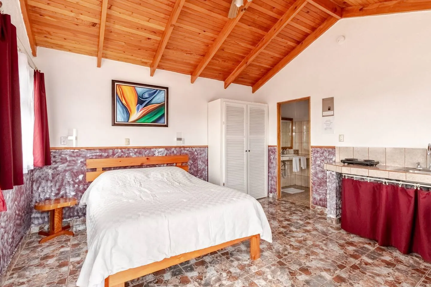 Colibri Cottage queen bed at Mango Valley
